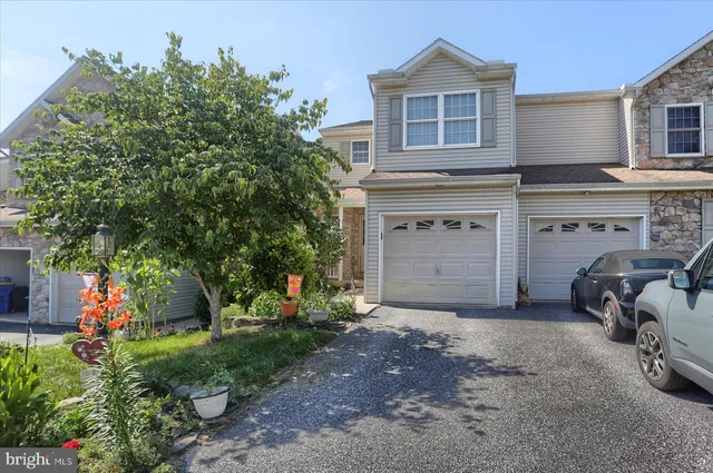 front view of a house with a garden