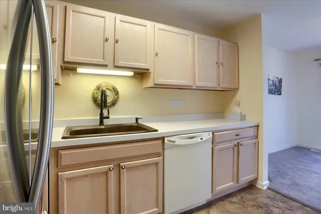 a kitchen with a sink and cabinets