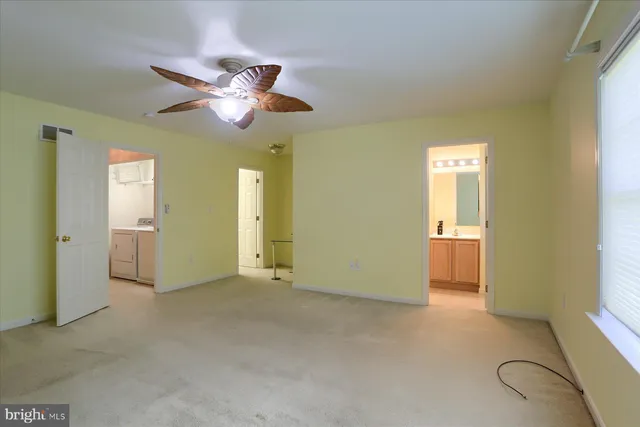a view of an empty room with a bathroom