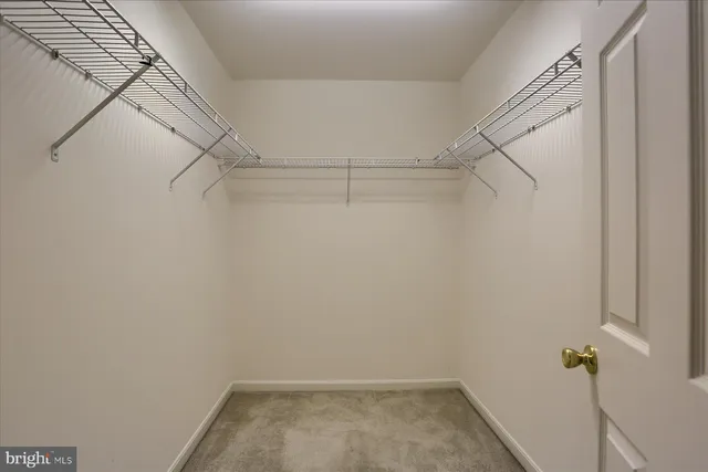 a view of a hallway with a window