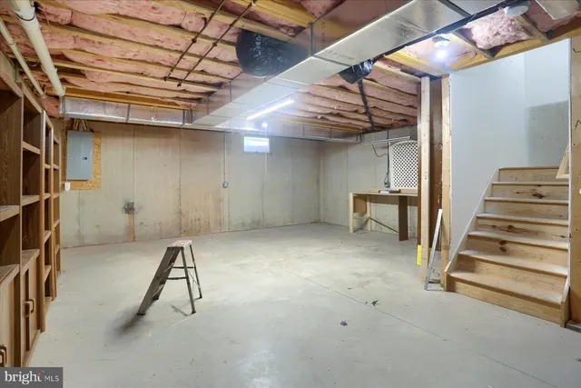 a view of a house with a yard and furniture