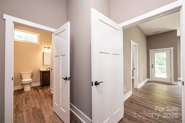 a bathroom with a toilet a sink and shower