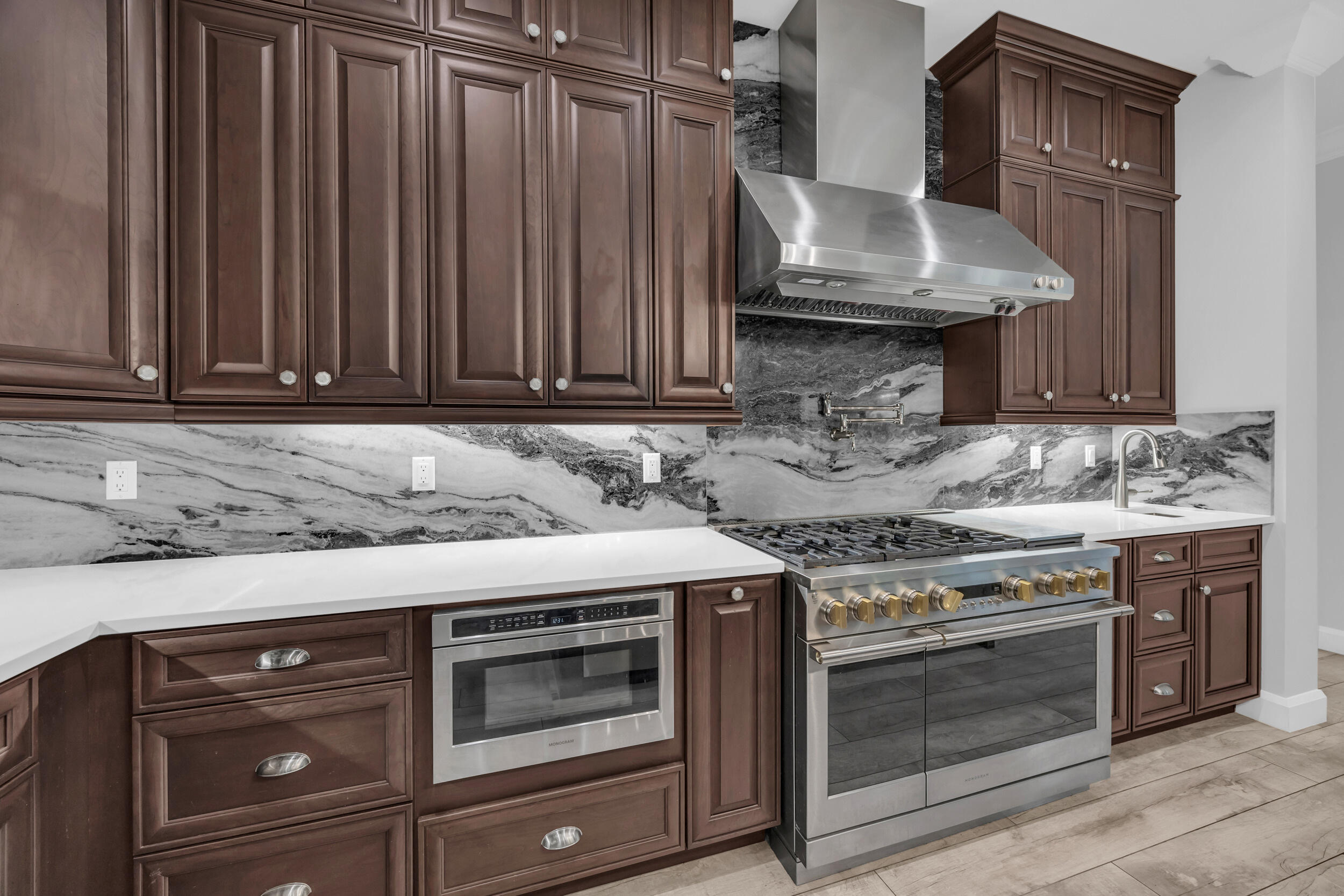 5481 Hibiscus Road Jupiter, FL 33458 - Photo 14 of 66 a kitchen with granite countertop a stove and a sink