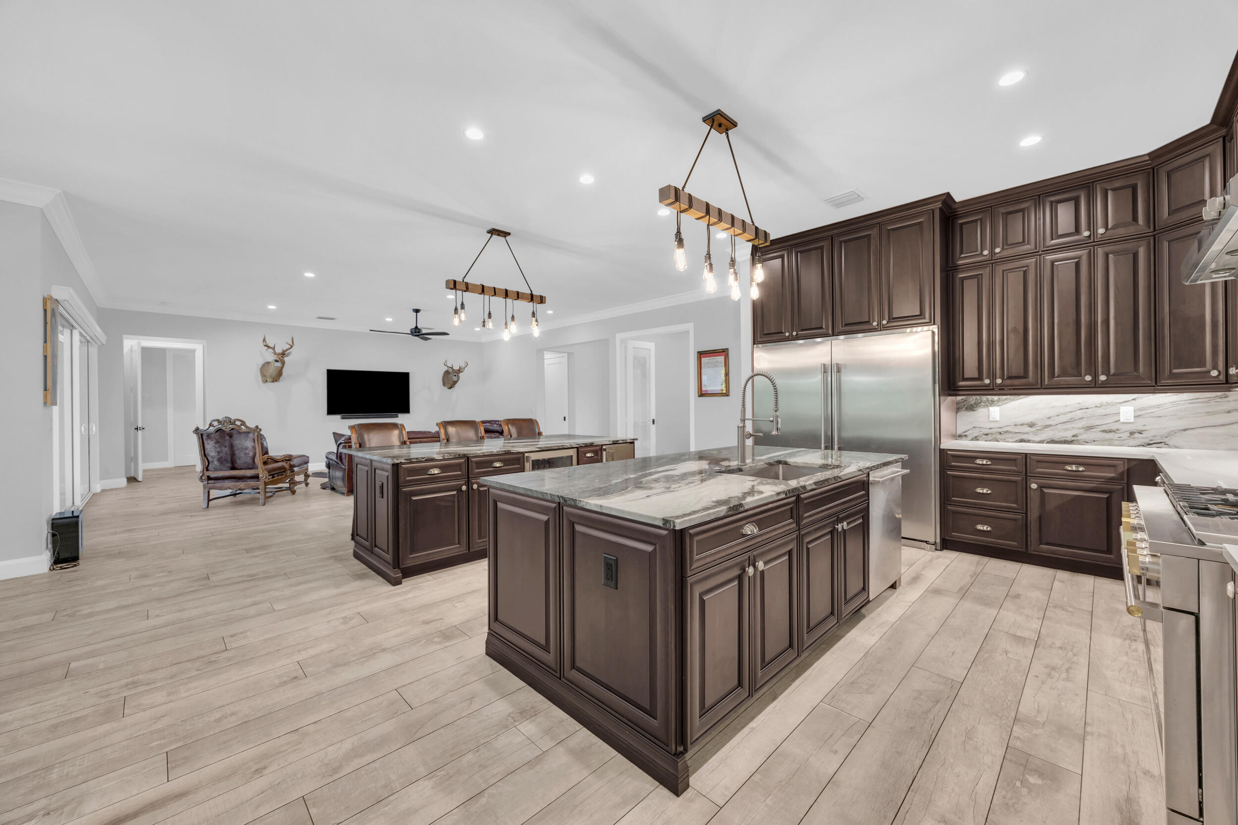 5481 Hibiscus Road Jupiter, FL 33458 - Photo 15 of 66 a kitchen with stainless steel appliances granite countertop a stove and a sink