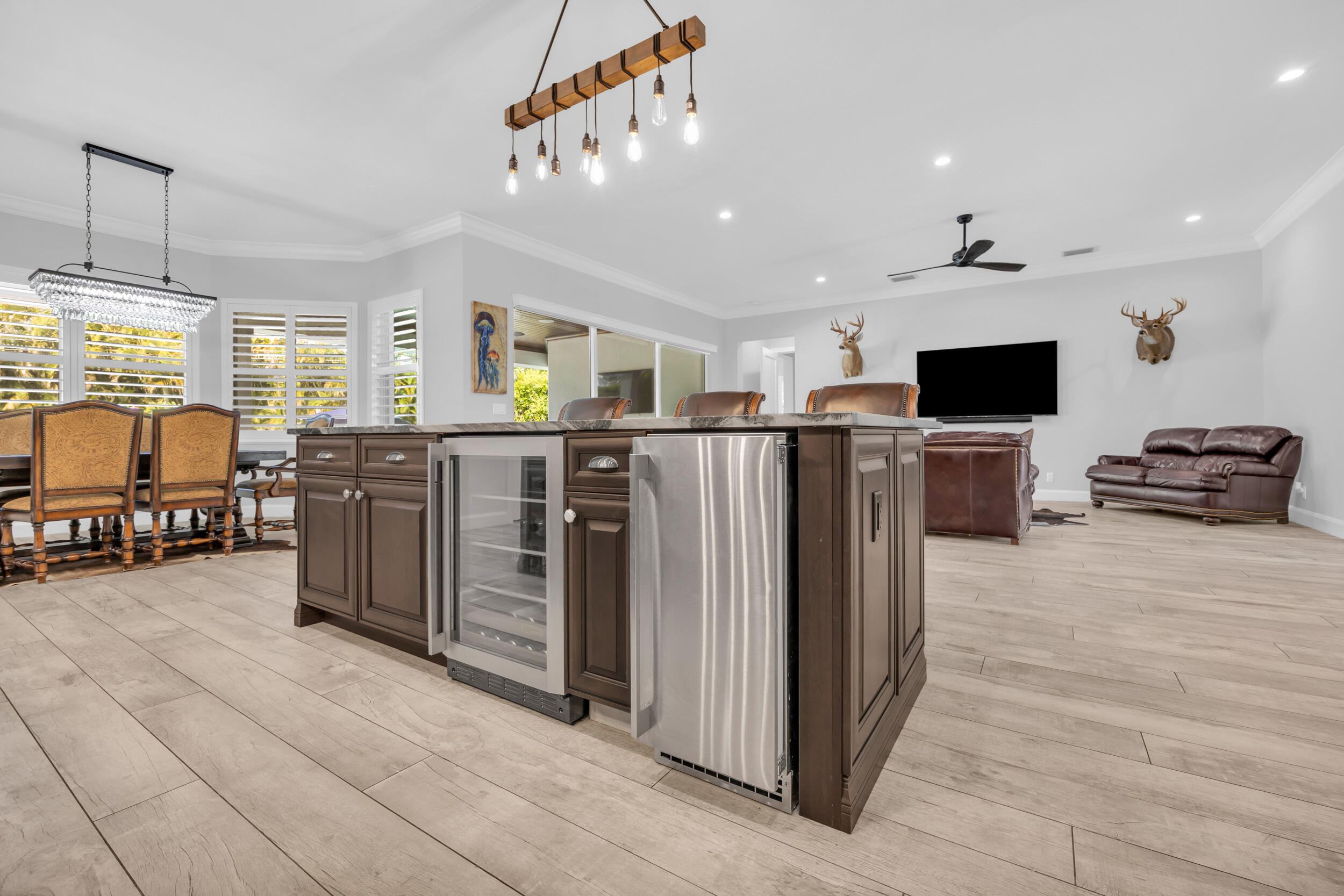 5481 Hibiscus Road Jupiter, FL 33458 - Photo 17 of 66 a view of a kitchen with furniture and a flat screen tv