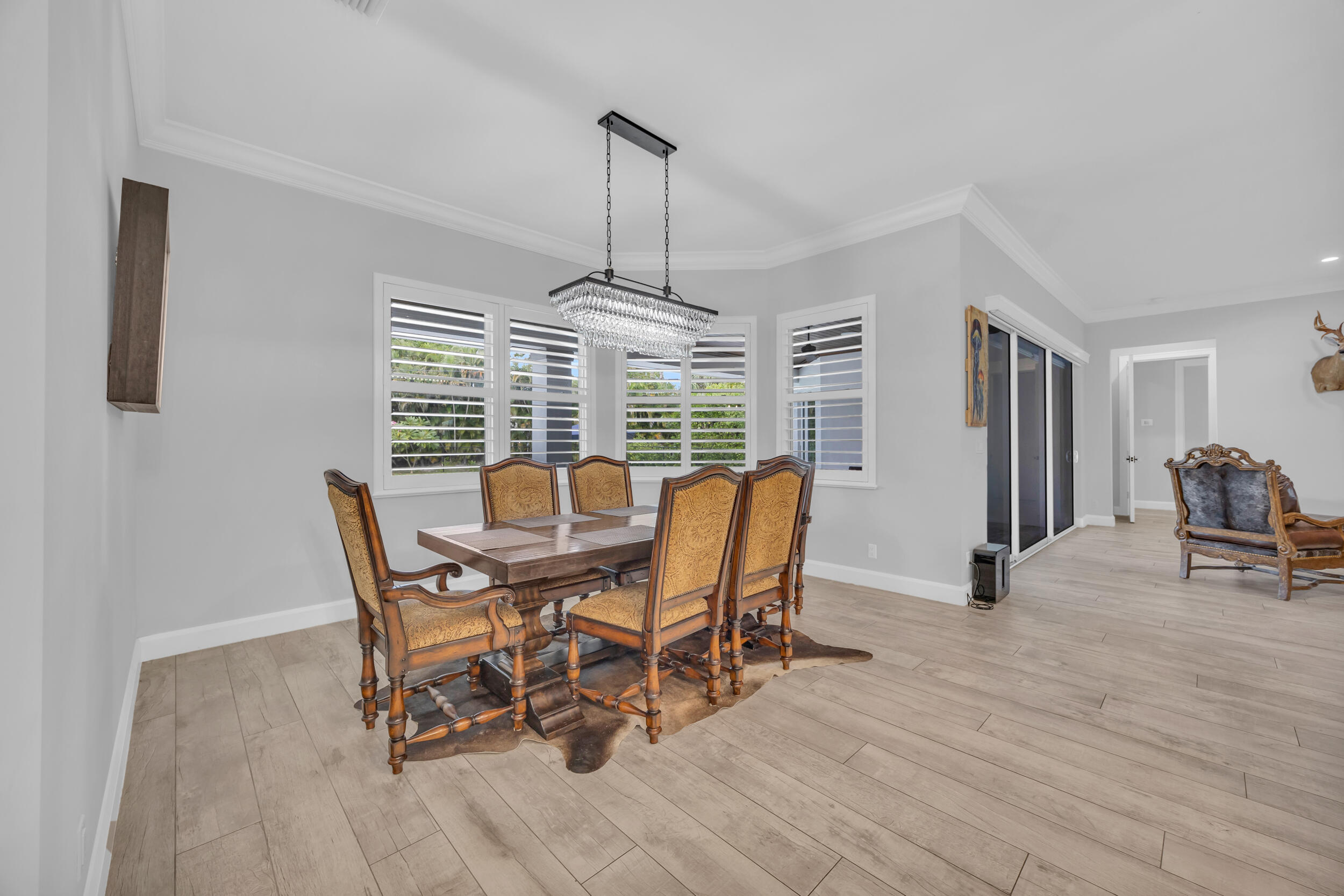 5481 Hibiscus Road Jupiter, FL 33458 - Photo 18 of 66 a view of a dining room with furniture window and wooden floor