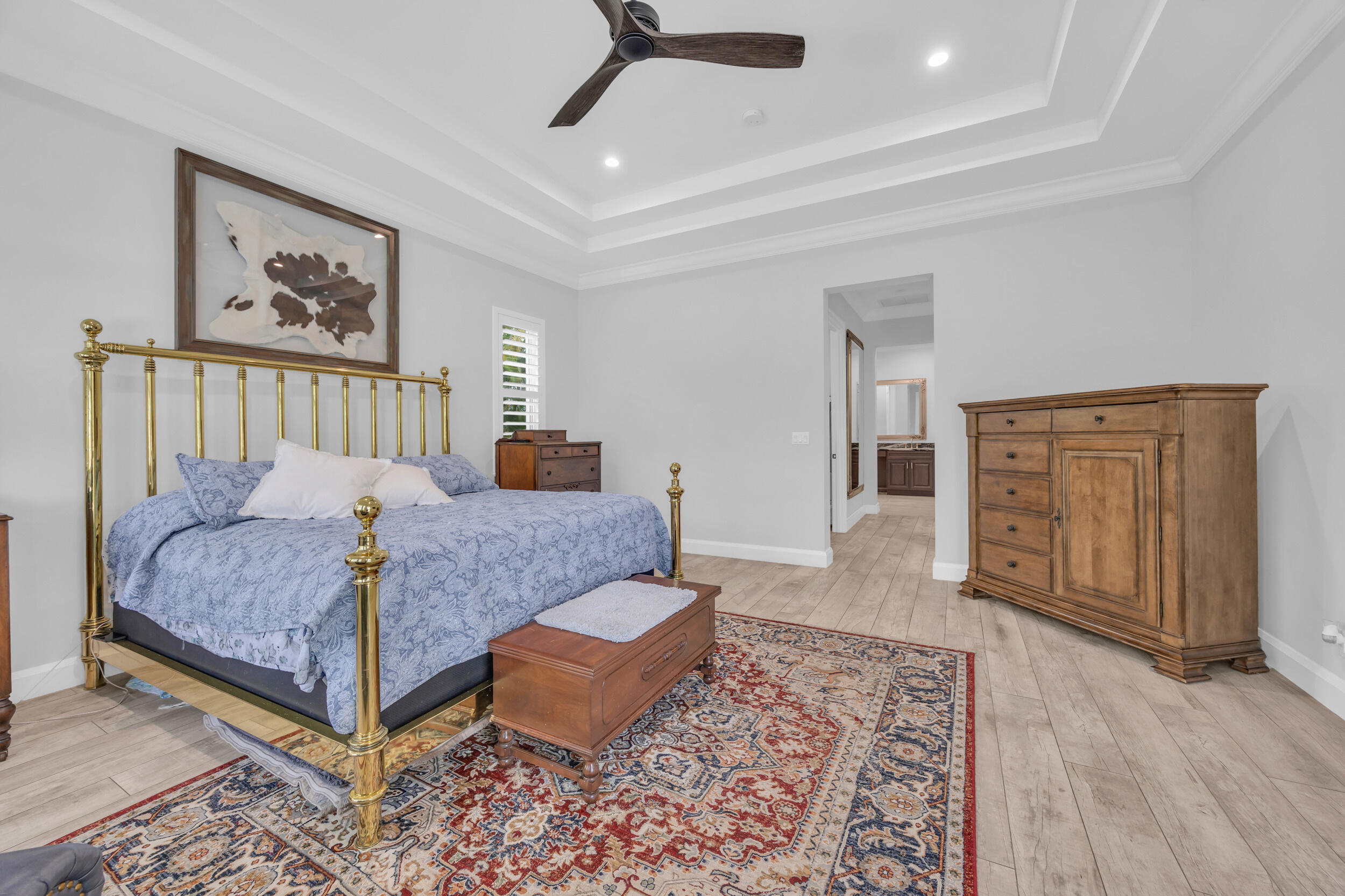 5481 Hibiscus Road Jupiter, FL 33458 - Photo 22 of 66 a bedroom with a bed and wooden floor