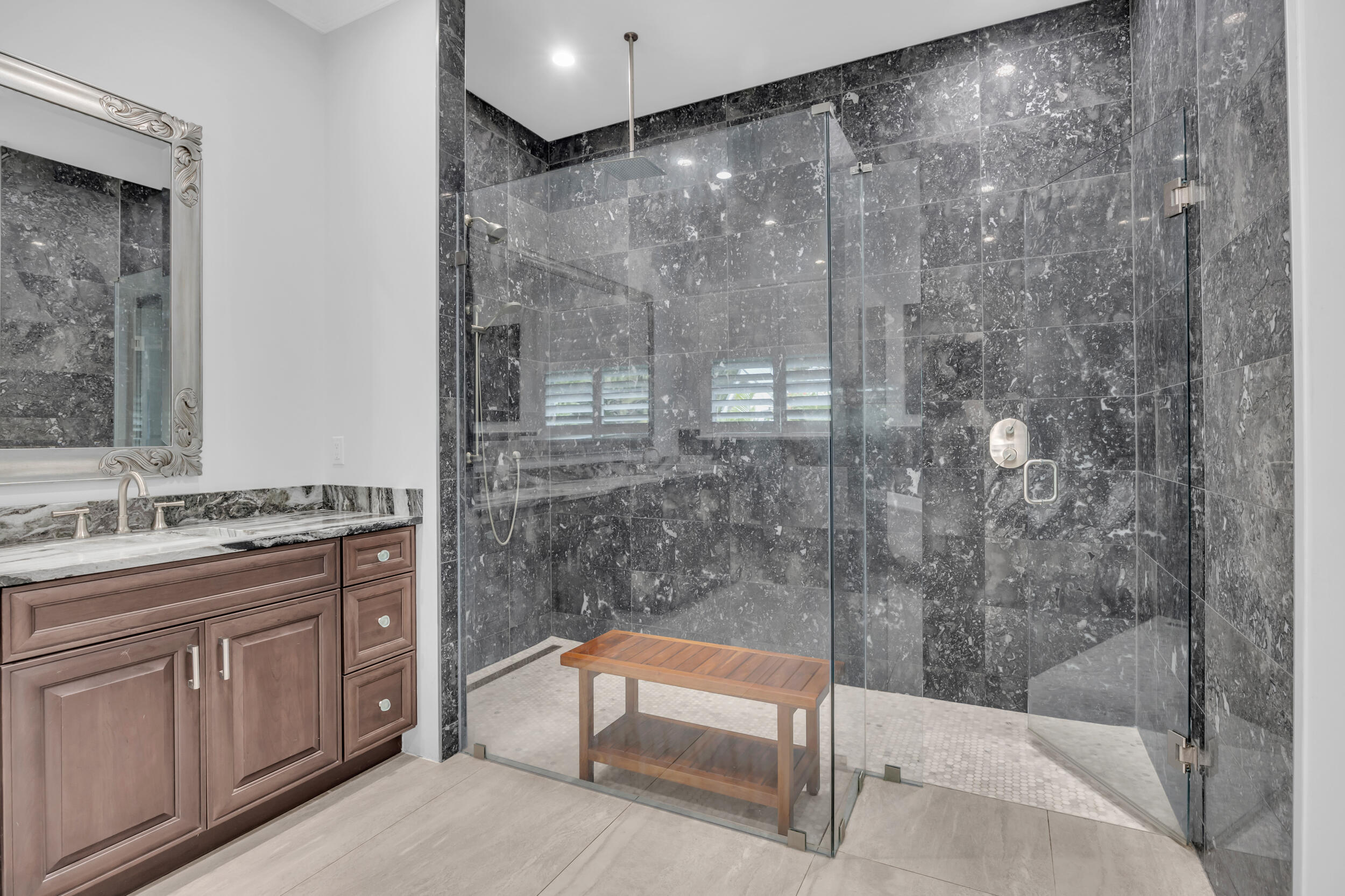 5481 Hibiscus Road Jupiter, FL 33458 - Photo 26 of 66 a bathroom with a granite countertop sink a toilet and shower