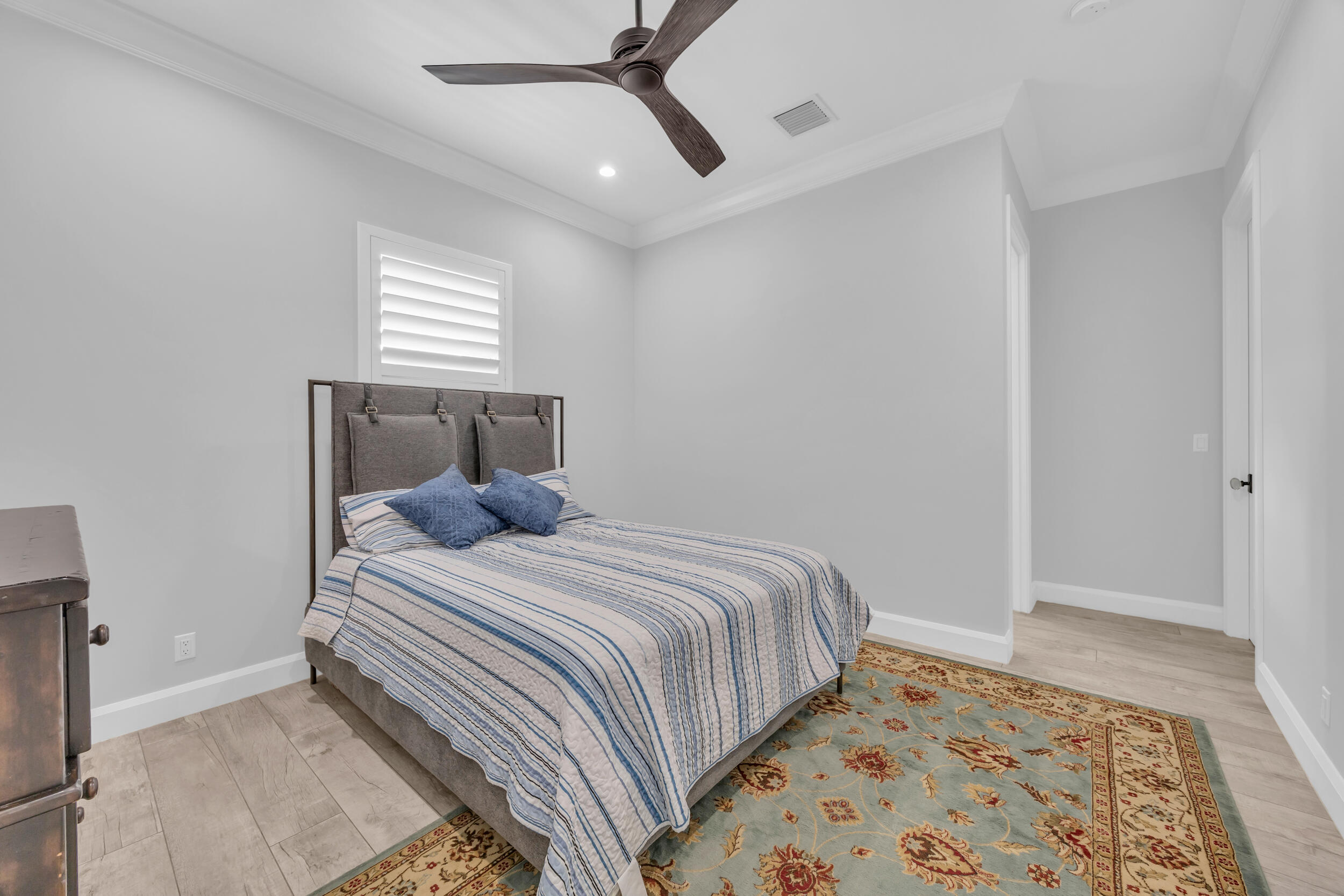5481 Hibiscus Road Jupiter, FL 33458 - Photo 32 of 66 a bedroom with a bed and a window