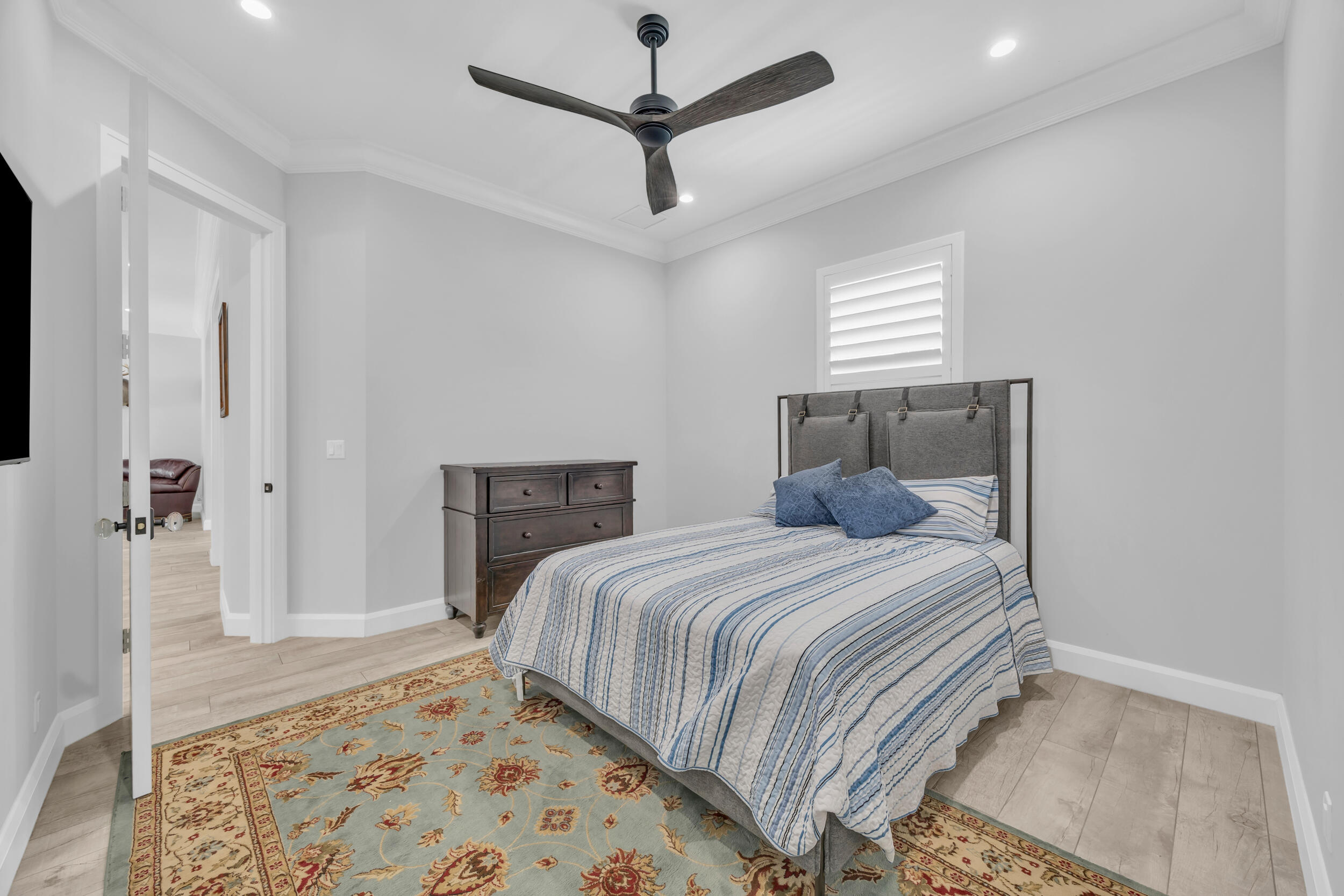 5481 Hibiscus Road Jupiter, FL 33458 - Photo 34 of 66 a bedroom with a bed and a rug