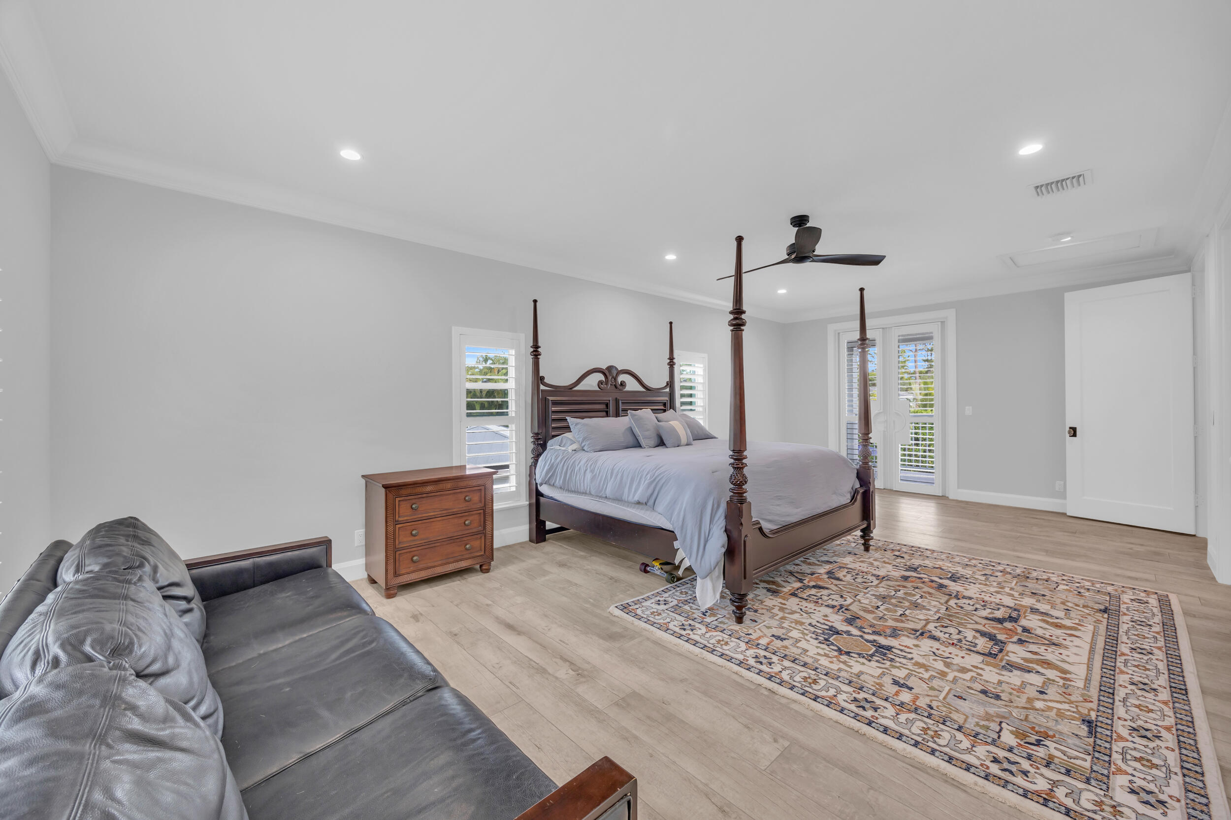 5481 Hibiscus Road Jupiter, FL 33458 - Photo 41 of 66 a bedroom with a bed and a dresser