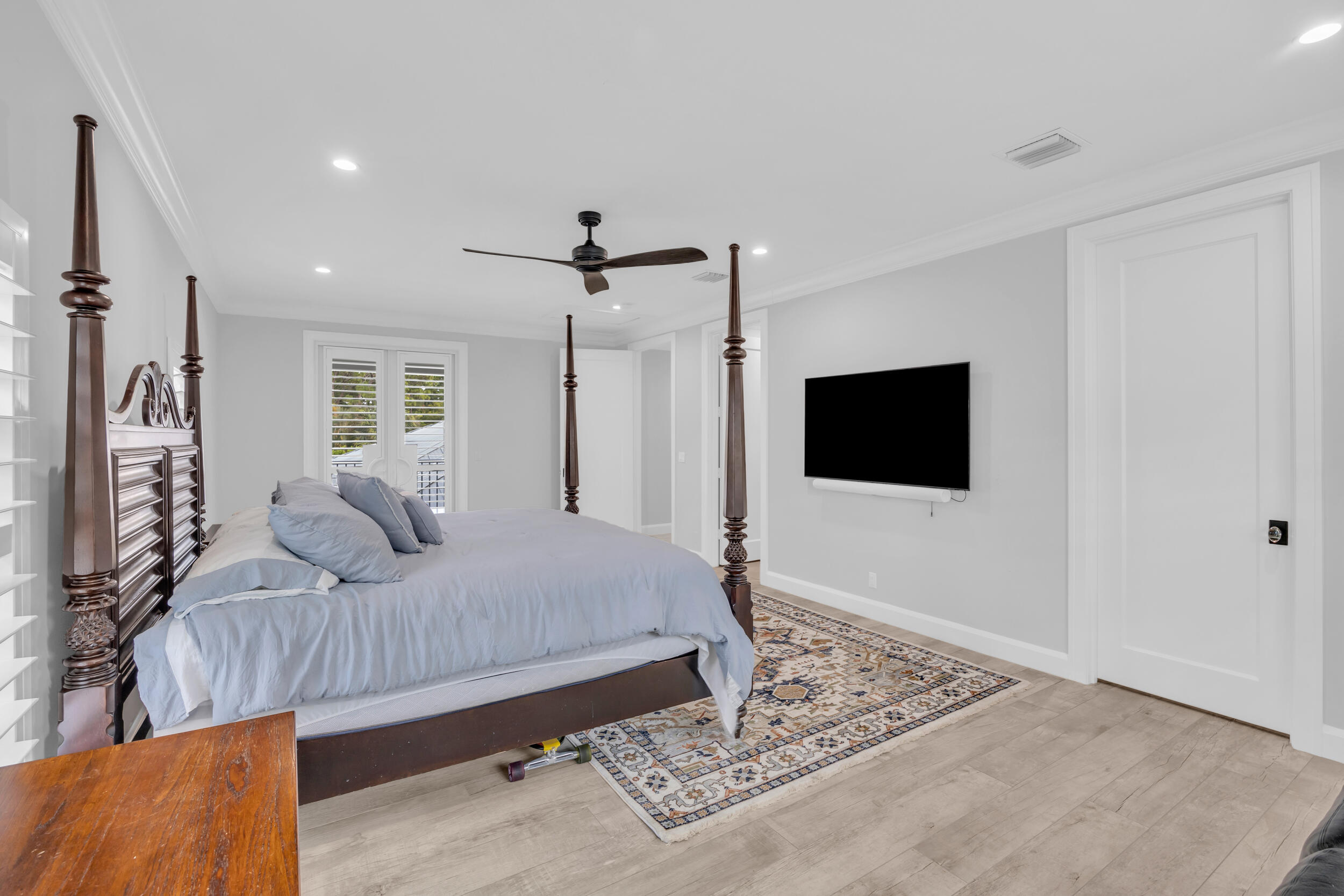 5481 Hibiscus Road Jupiter, FL 33458 - Photo 42 of 66 a bedroom with a bed and a television