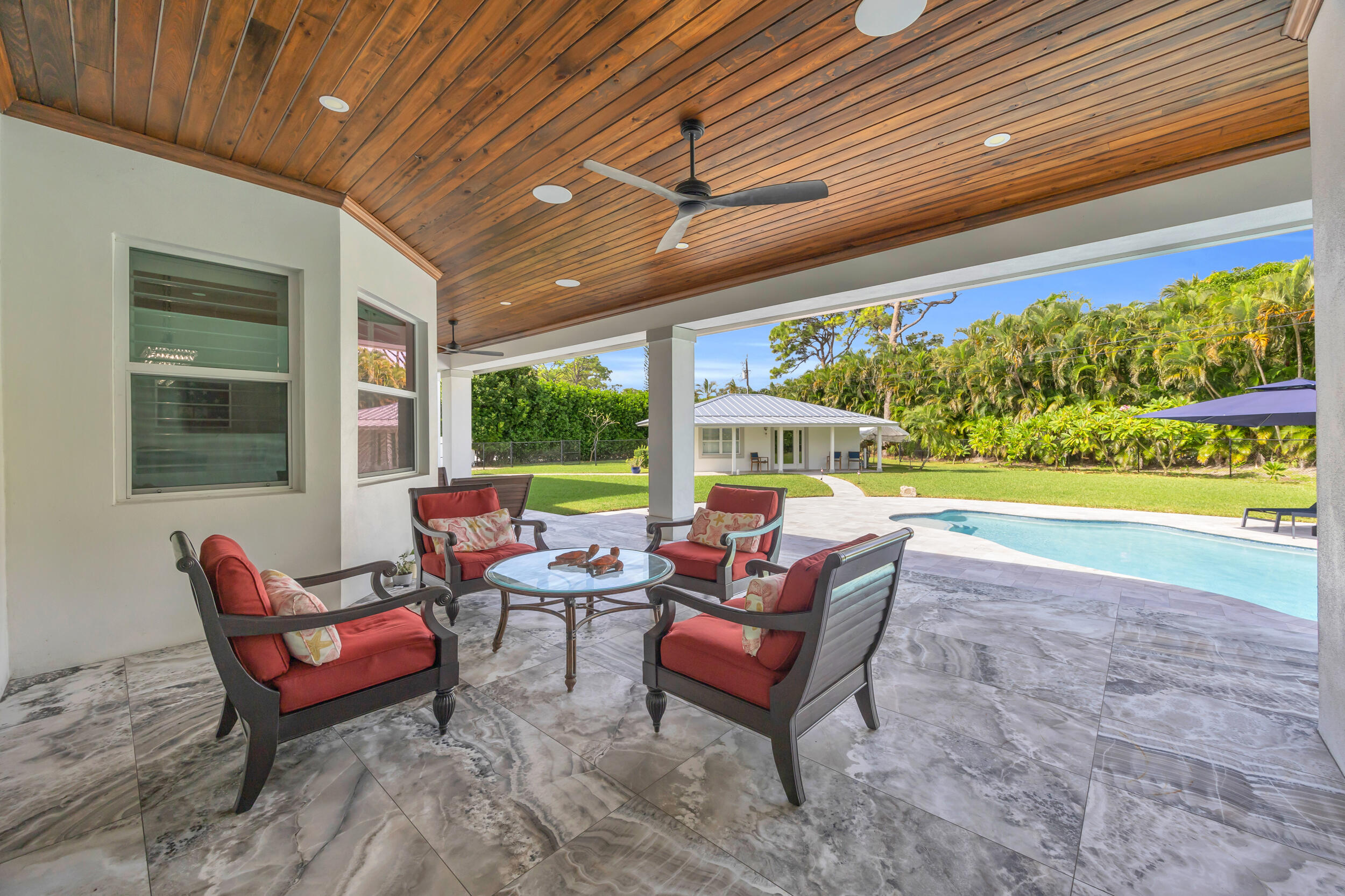 5481 Hibiscus Road Jupiter, FL 33458 - Photo 48 of 66 a building outdoor space with seating space
