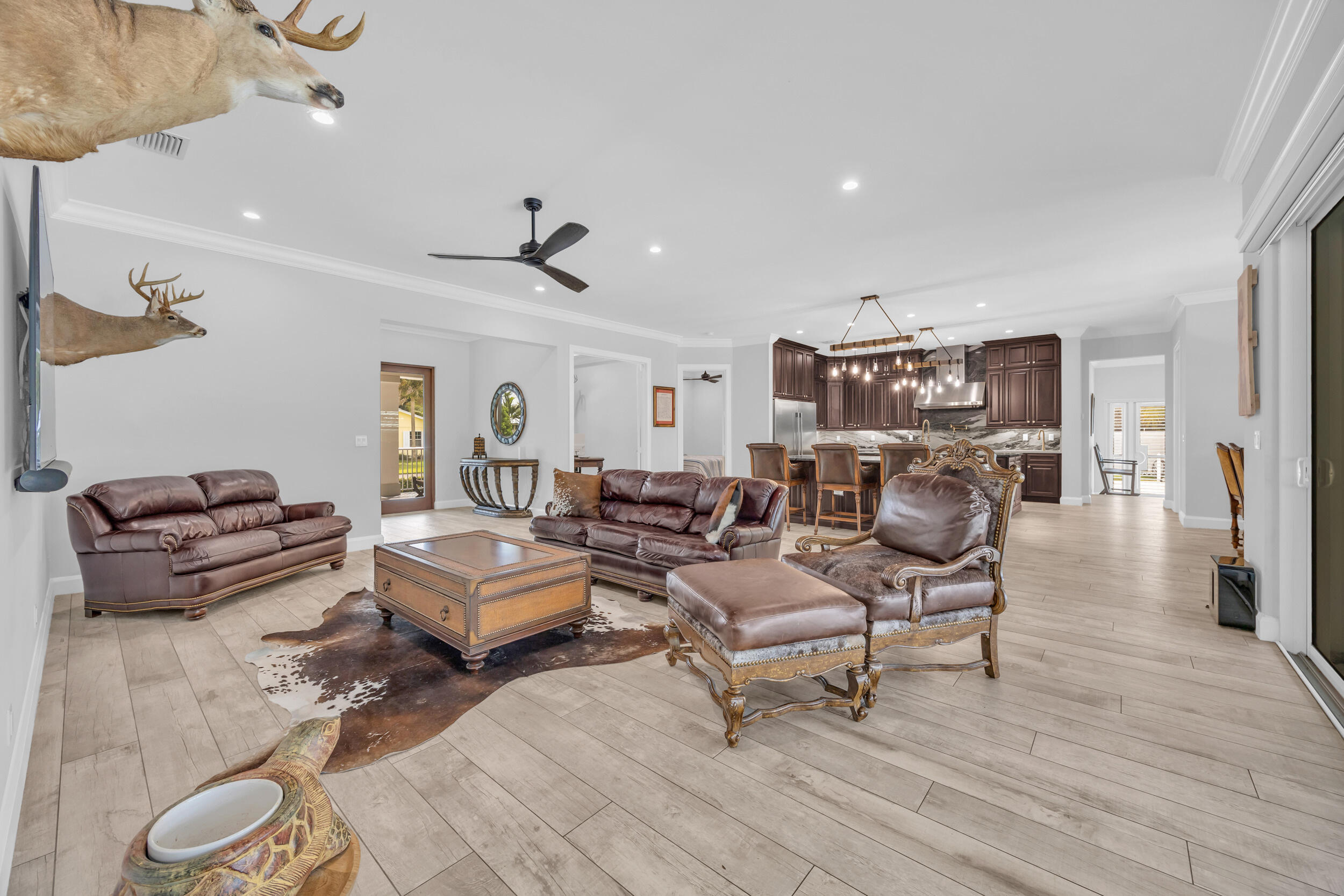 5481 Hibiscus Road Jupiter, FL 33458 - Photo 6 of 66 a living room with furniture and a wooden floor