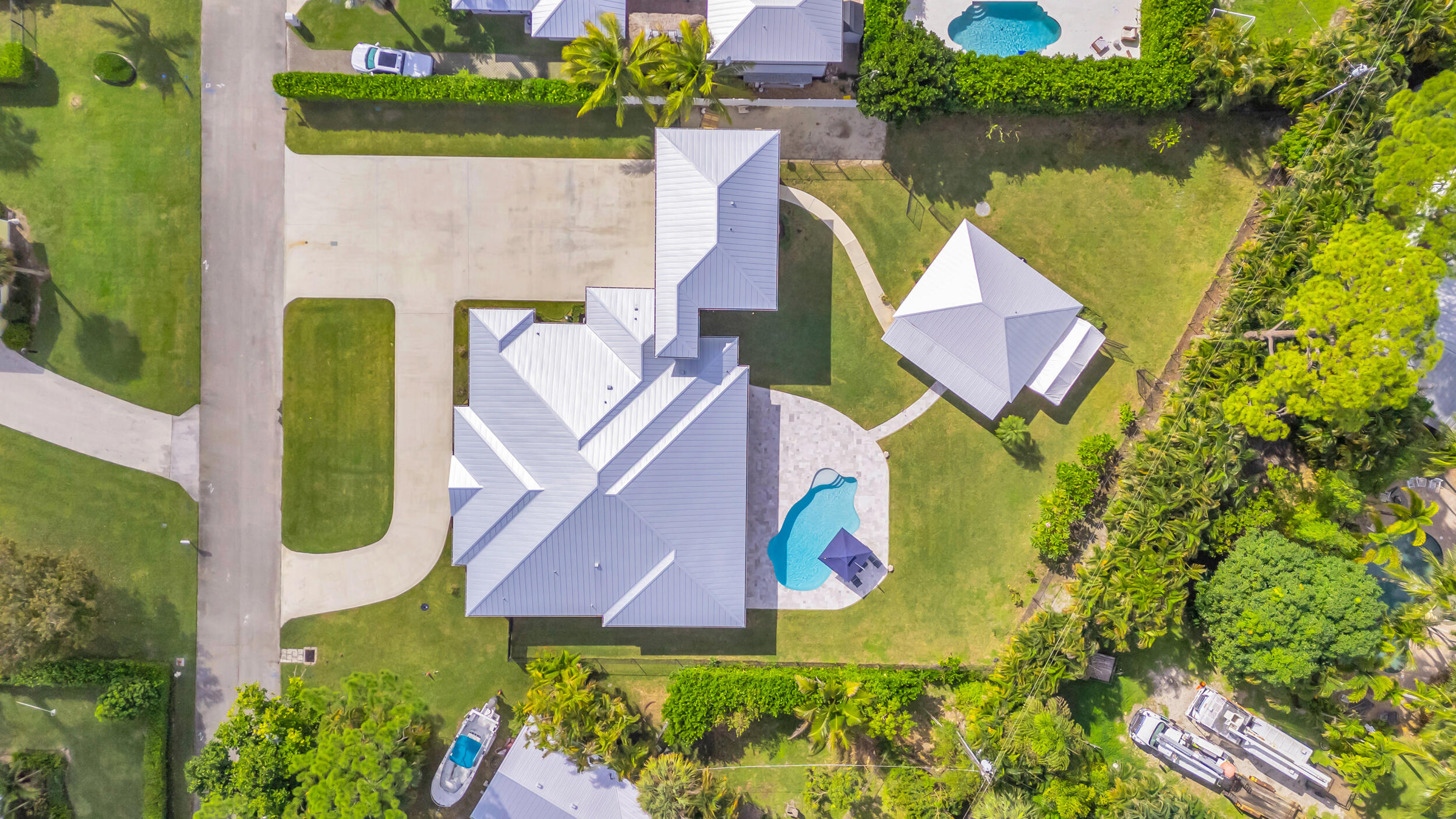 5481 Hibiscus Road Jupiter, FL 33458 - Photo 61 of 66 an aerial view of a house with outdoor space pool seating area and yard