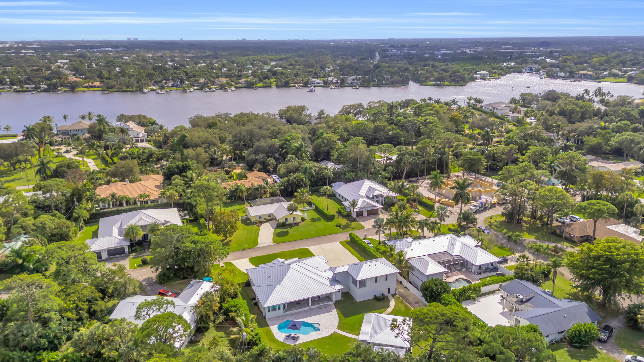 5481 Hibiscus Road Jupiter, FL 33458 - Photo 64 of 66 an aerial view of residential houses with outdoor space