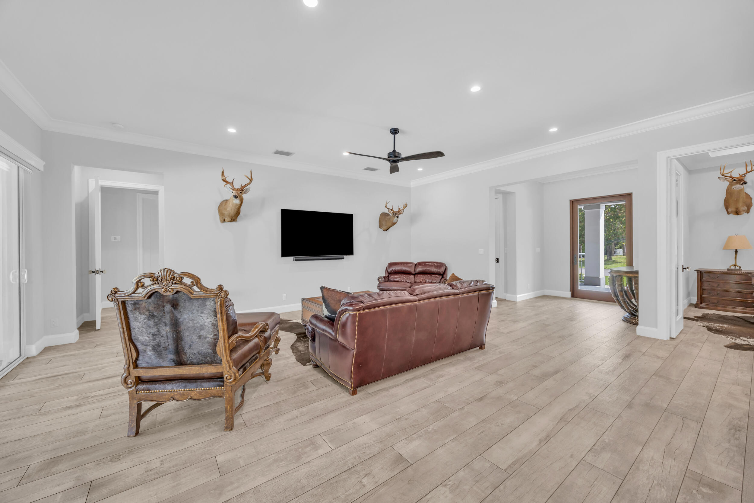 5481 Hibiscus Road Jupiter, FL 33458 - Photo 7 of 66 a living room with furniture and a flat screen tv