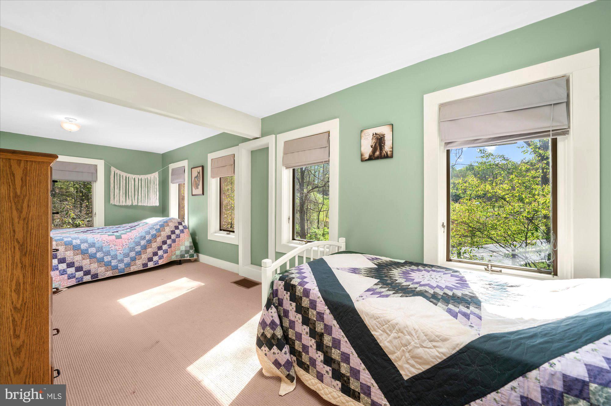 63 Hampshire Road Sinking Spring, PA 19608 - Photo 28 of 86 a bedroom with a large bed and a large window