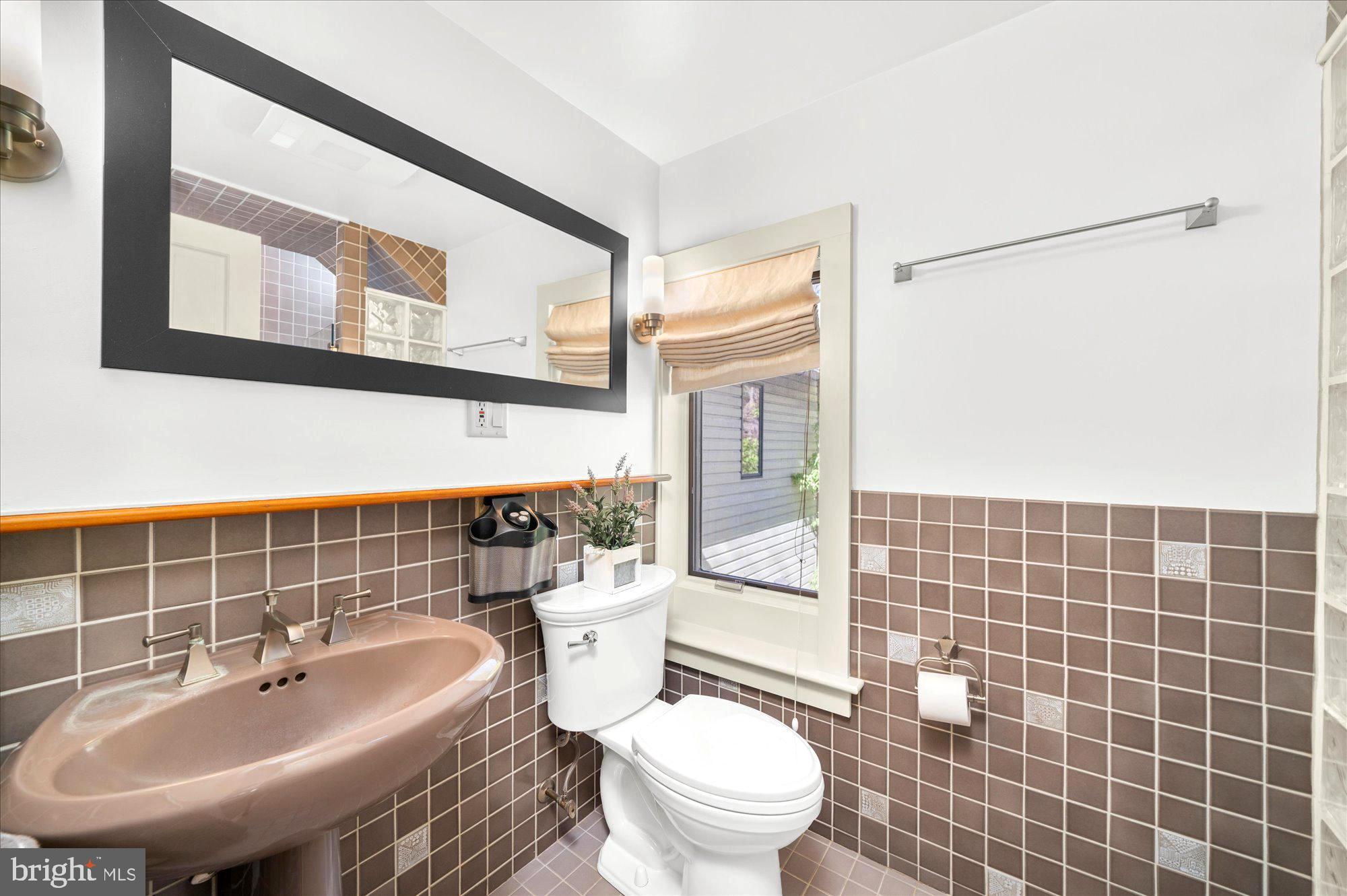 63 Hampshire Road Sinking Spring, PA 19608 - Photo 29 of 86 a bathroom with a sink a toilet and shower