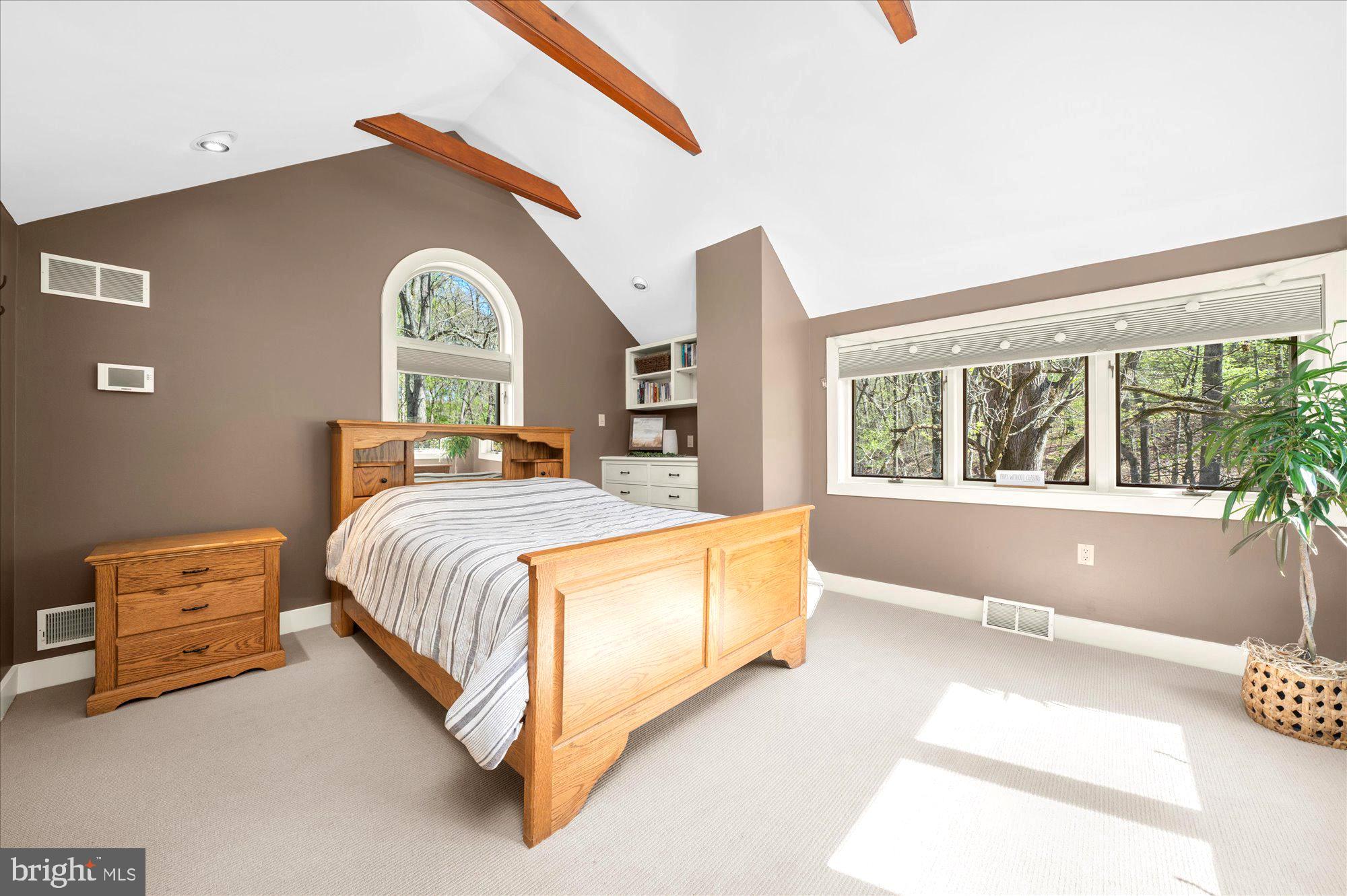 63 Hampshire Road Sinking Spring, PA 19608 - Photo 31 of 86 a spacious bedroom with a bed and a large window