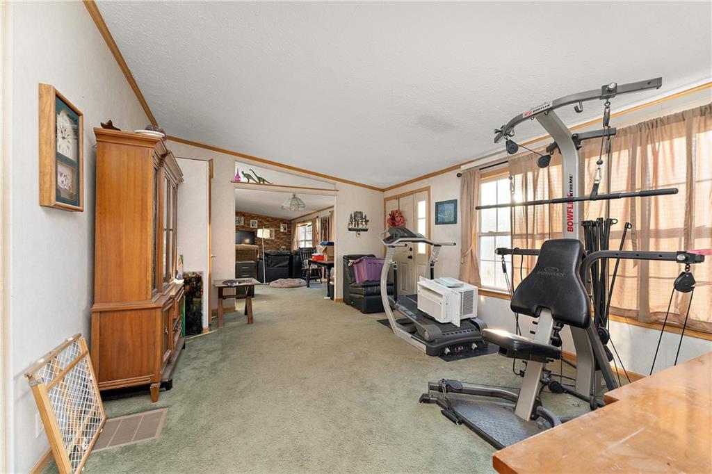151 Eagle Mill Road Butler, PA 16001 - Photo 11 of 25 a view of a livingroom with gym equipment