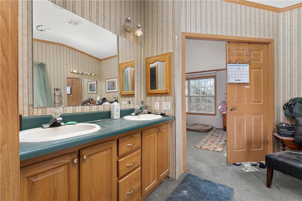151 Eagle Mill Road Butler, PA 16001 - Photo 13 of 25 a spacious bathroom with a sink double vanity and a shower