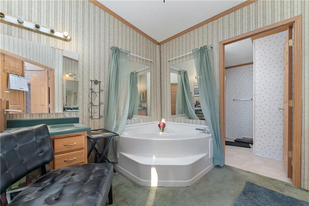 151 Eagle Mill Road Butler, PA 16001 - Photo 14 of 25 a spacious bathroom with sink and mirror