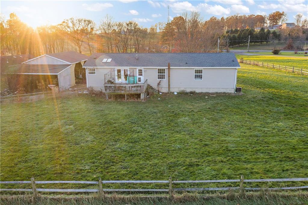 151 Eagle Mill Road Butler, PA 16001 - Photo 21 of 25 a view of a big room with a swimming pool and a yard