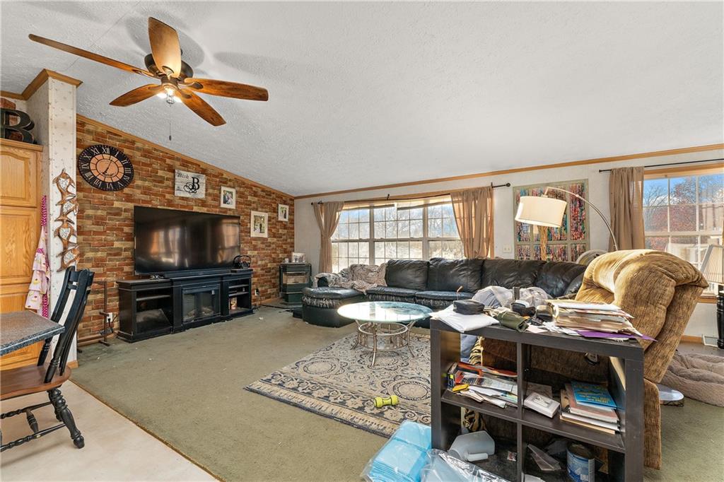 151 Eagle Mill Road Butler, PA 16001 - Photo 6 of 25 a living room with furniture and a flat screen tv
