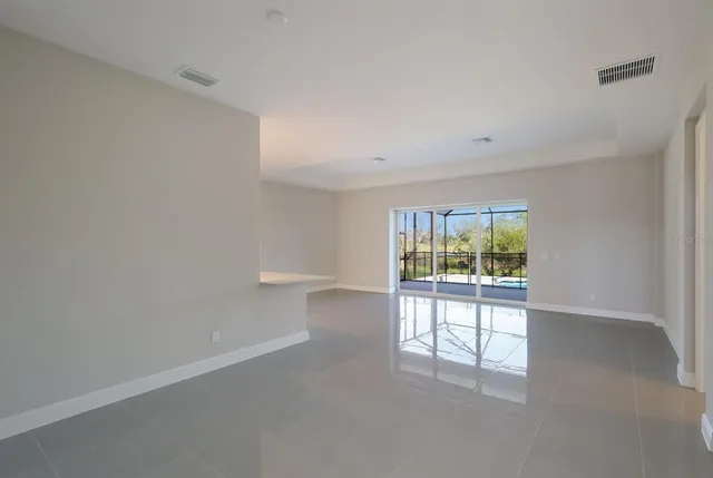 a kitchen with white cabinets and appliances