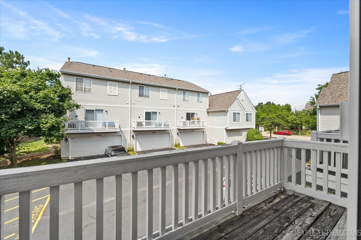3382 Ravinia Circle, Unit 3382 Aurora, IL 60504 - Photo 15 of 33 a view of a street from a balcony