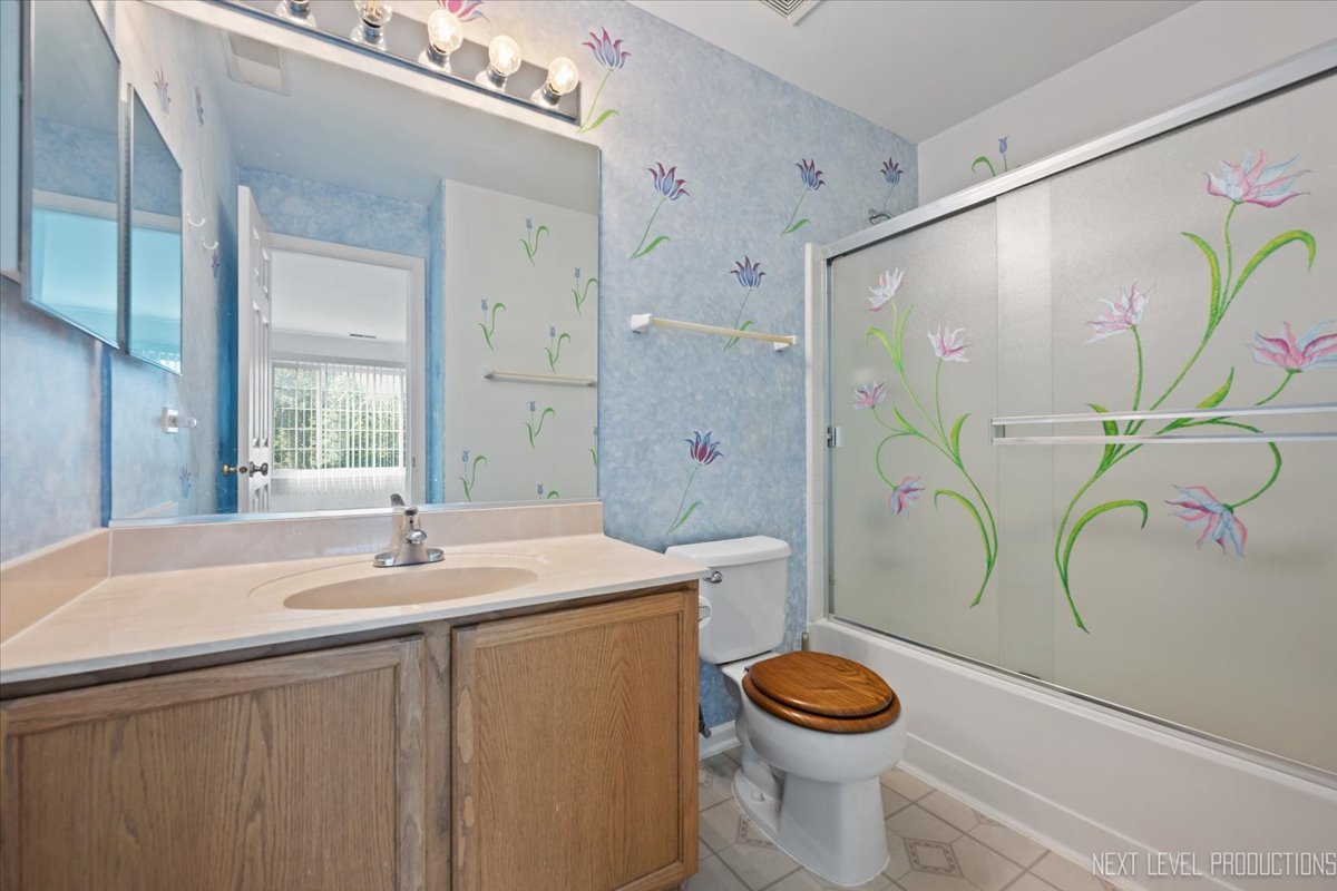 3382 Ravinia Circle, Unit 3382 Aurora, IL 60504 - Photo 19 of 33 a bathroom with a sink a toilet and shower
