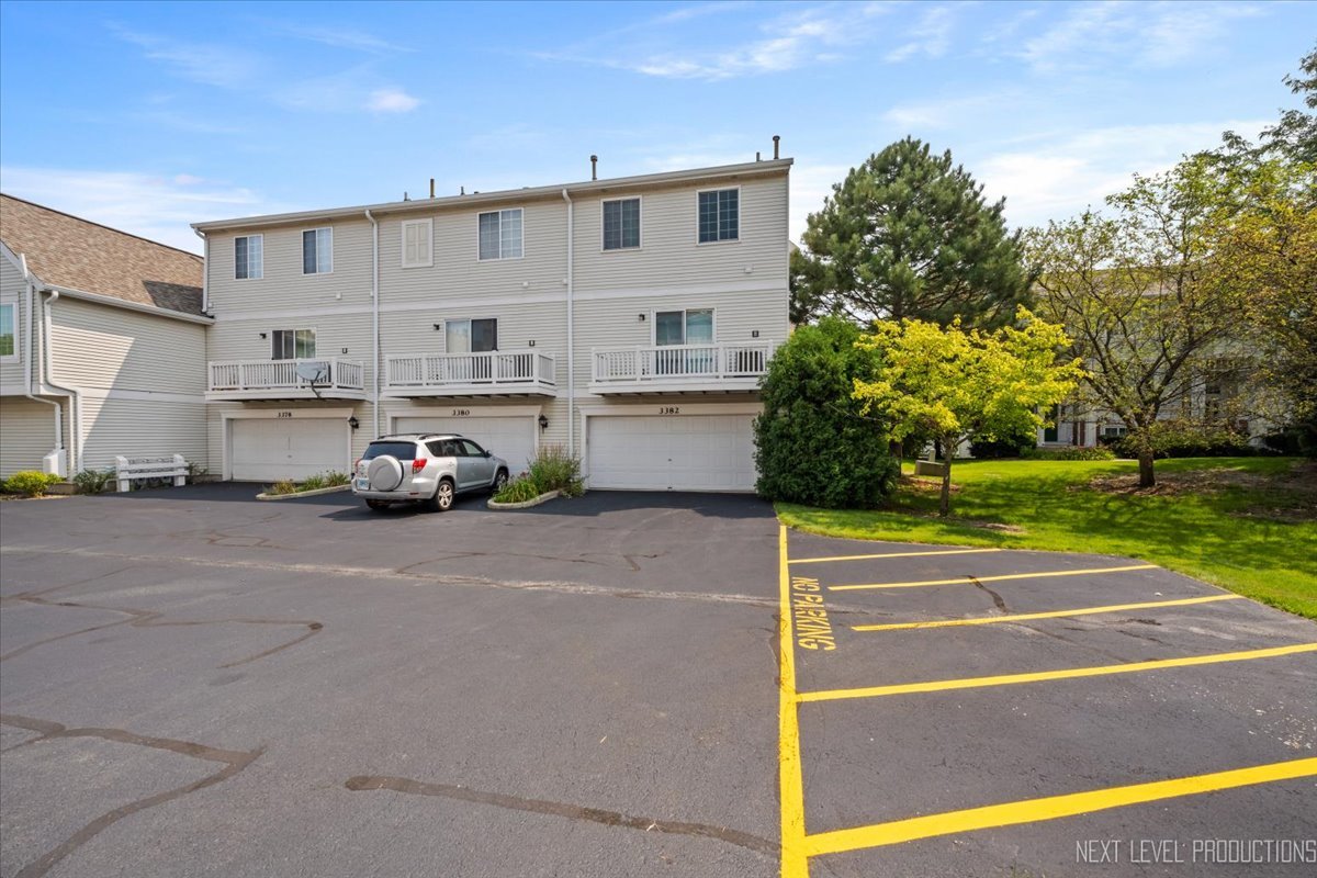 3382 Ravinia Circle, Unit 3382 Aurora, IL 60504 - Photo 29 of 33 a view of a street with cars