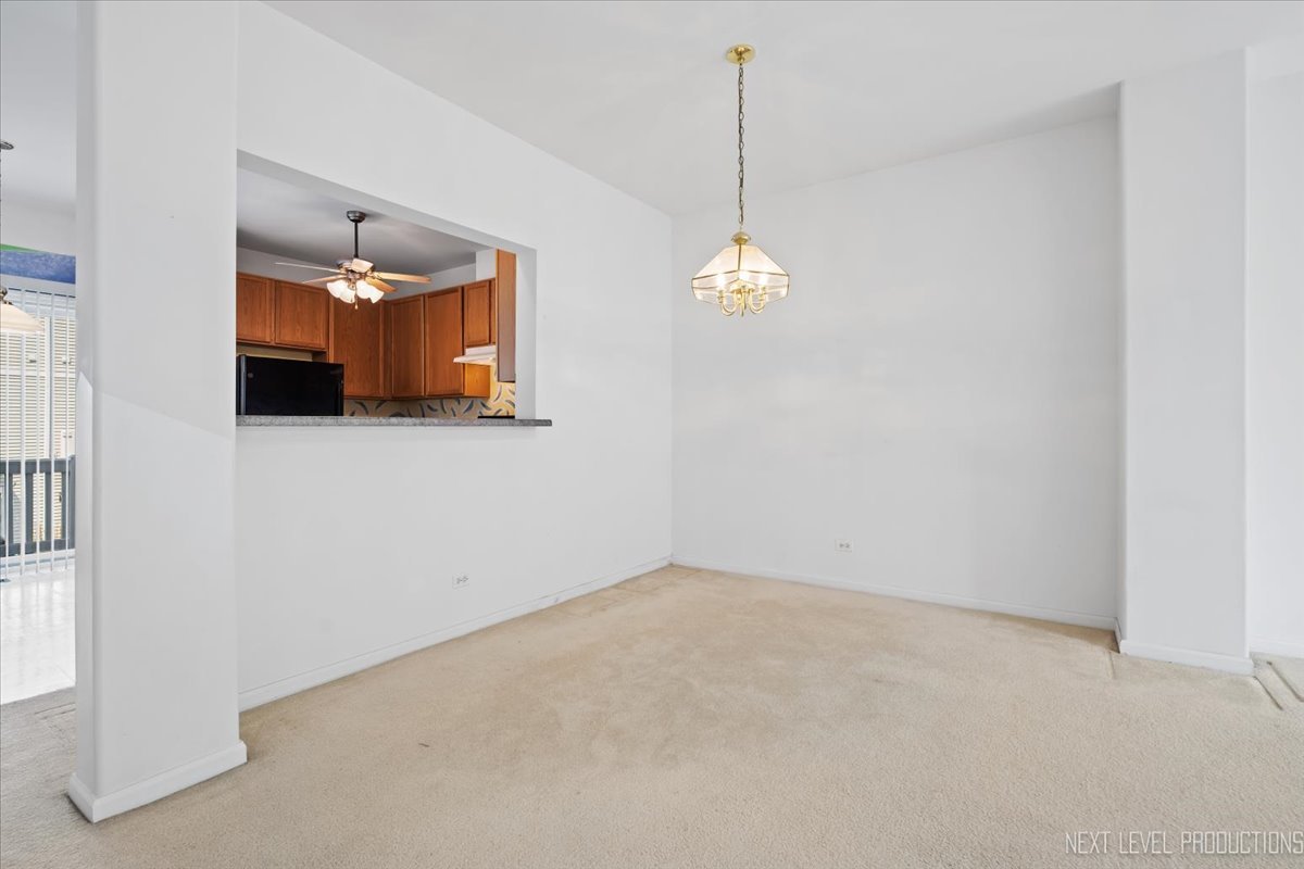 3382 Ravinia Circle, Unit 3382 Aurora, IL 60504 - Photo 8 of 33 a view of an empty room