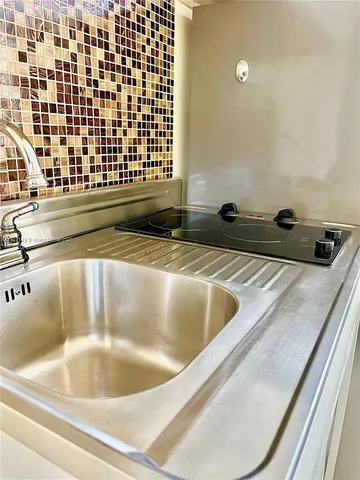 a view of a bathroom sink and a bathtub