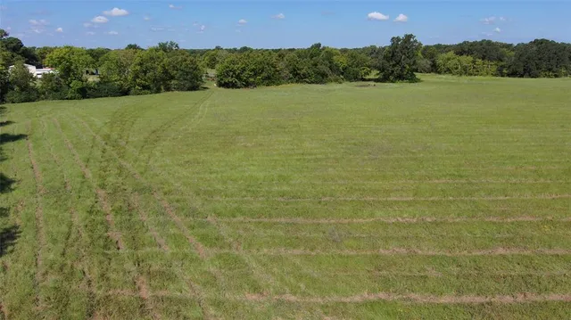 a view of a lake with a yard
