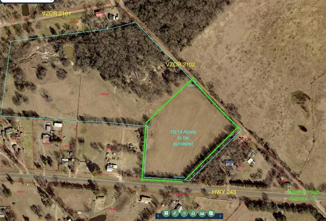 a view of a lake with houses in the background