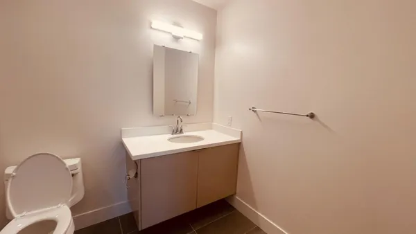 a bathroom with a toilet a sink and bathtub