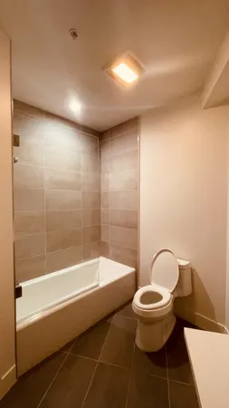 a room with a book shelf and wooden floor