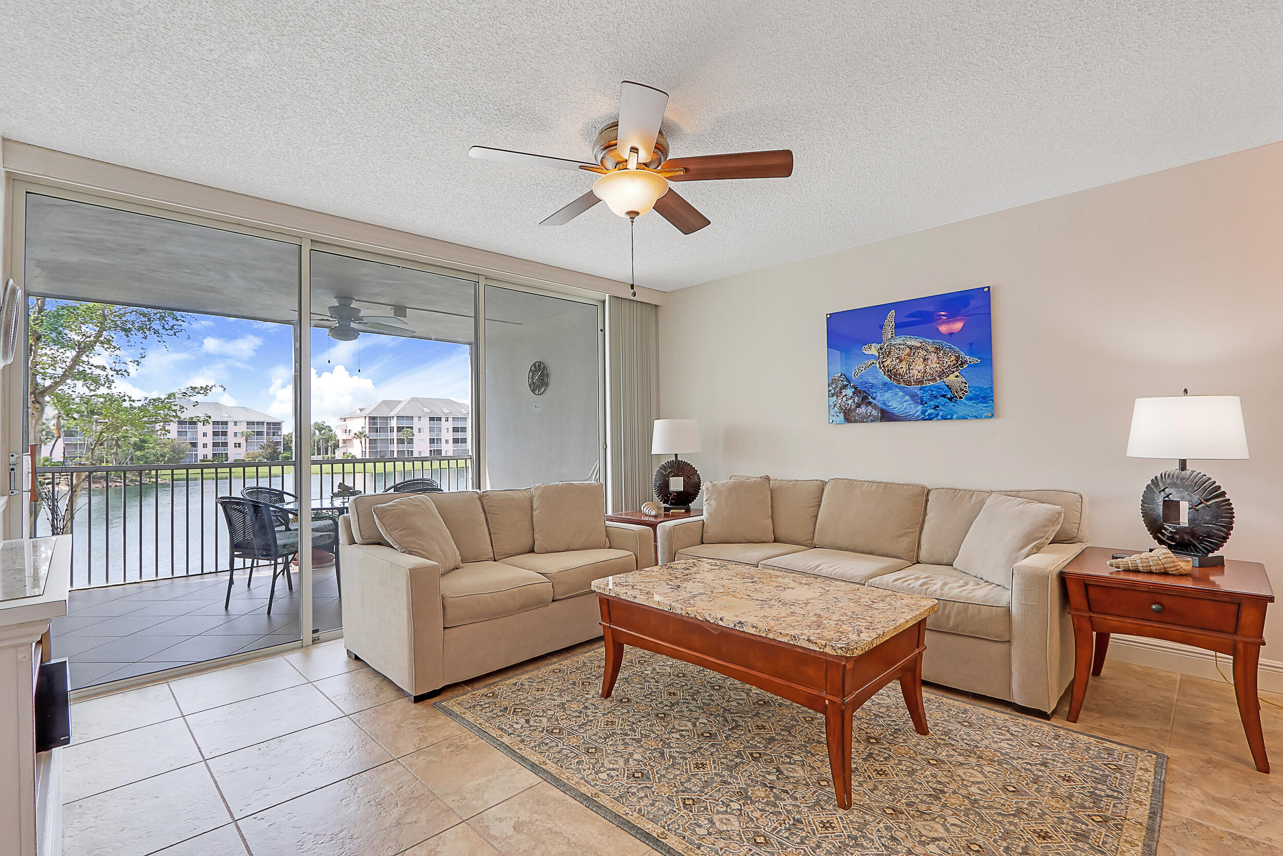 353 Highway 1, Unit A207 Jupiter, FL 33477 - Photo 1 of 28 a living room with furniture a rug and a large window