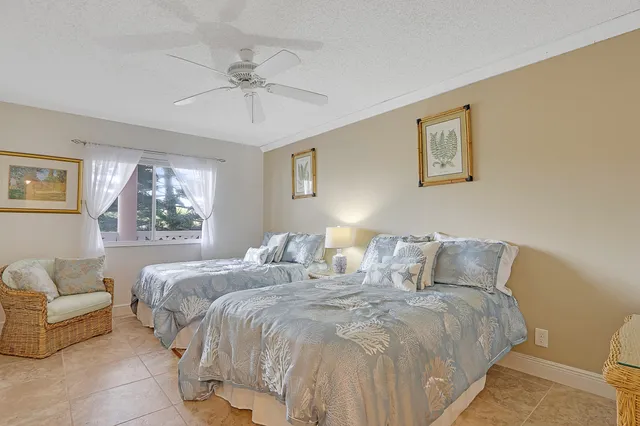 a bedroom with bed and a window