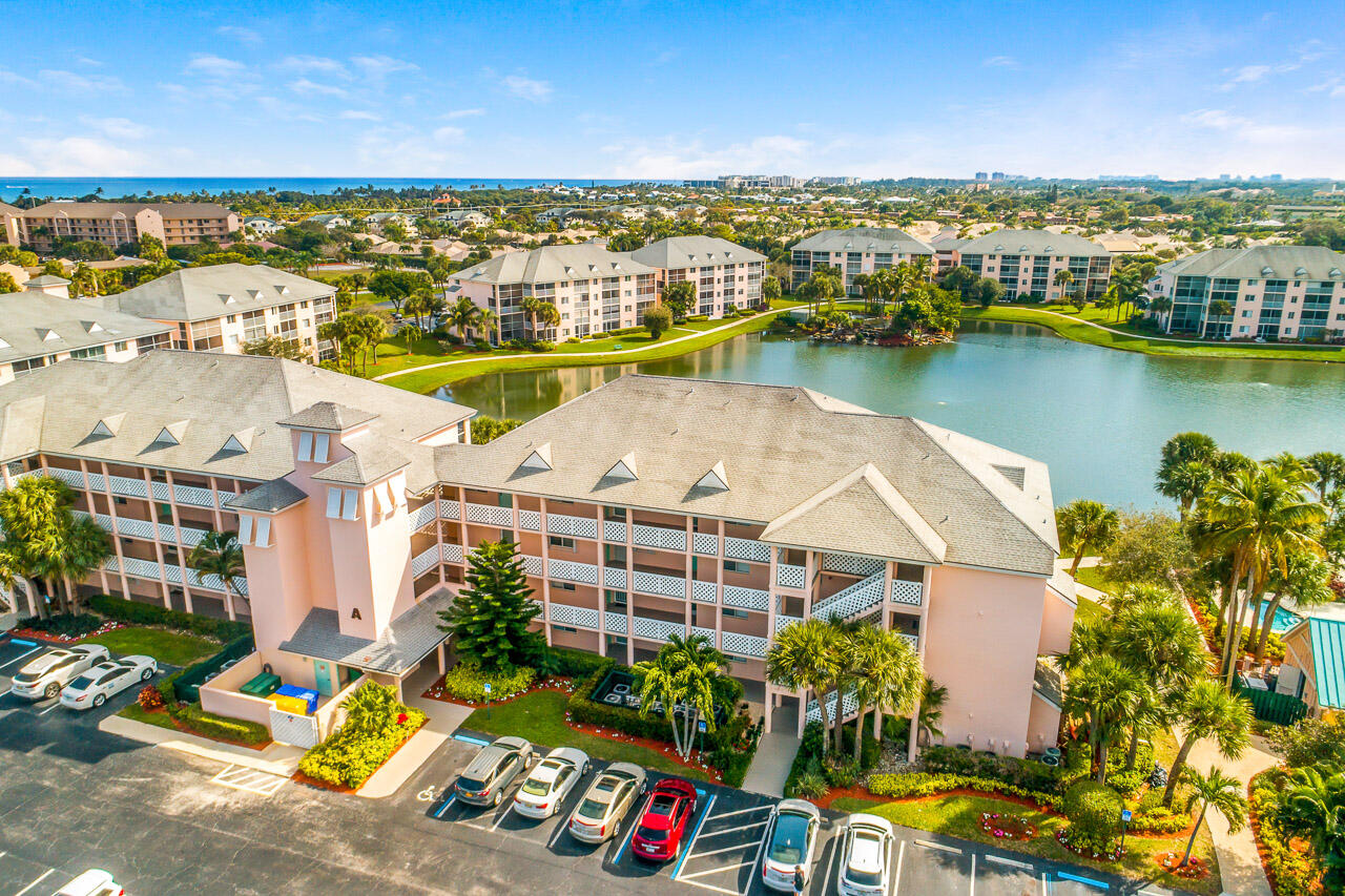 353 Highway 1, Unit A207 Jupiter, FL 33477 - Photo 2 of 28 an aerial view of residential houses with outdoor space and ocean view
