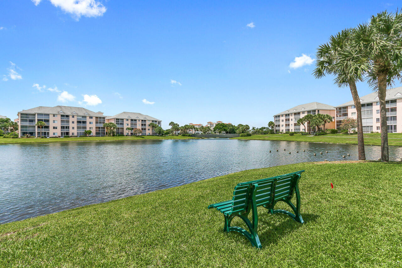 353 Highway 1, Unit A207 Jupiter, FL 33477 - Photo 21 of 28 a view of a lake with a house in the background