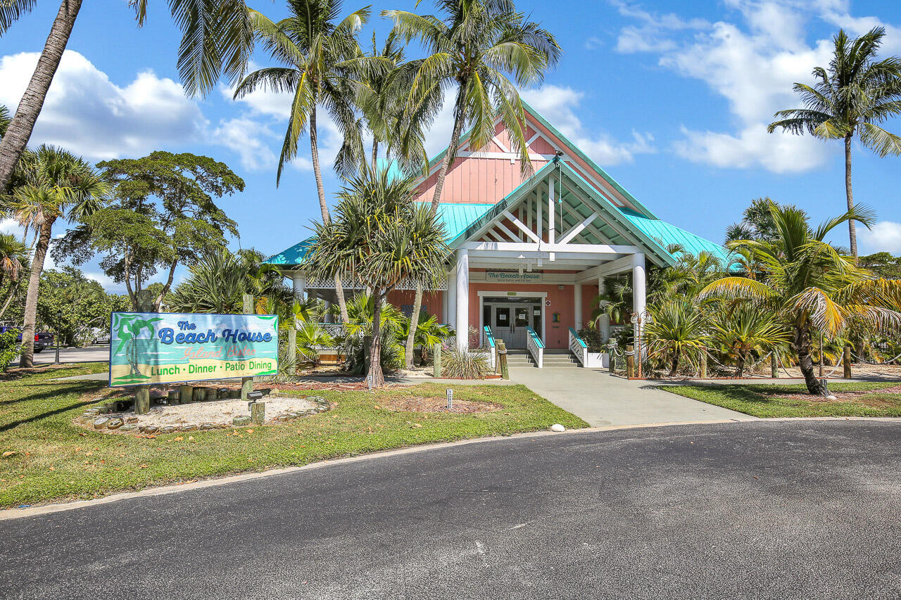 353 Highway 1, Unit A207 Jupiter, FL 33477 - Photo 22 of 28 a front view of house with yard and green space