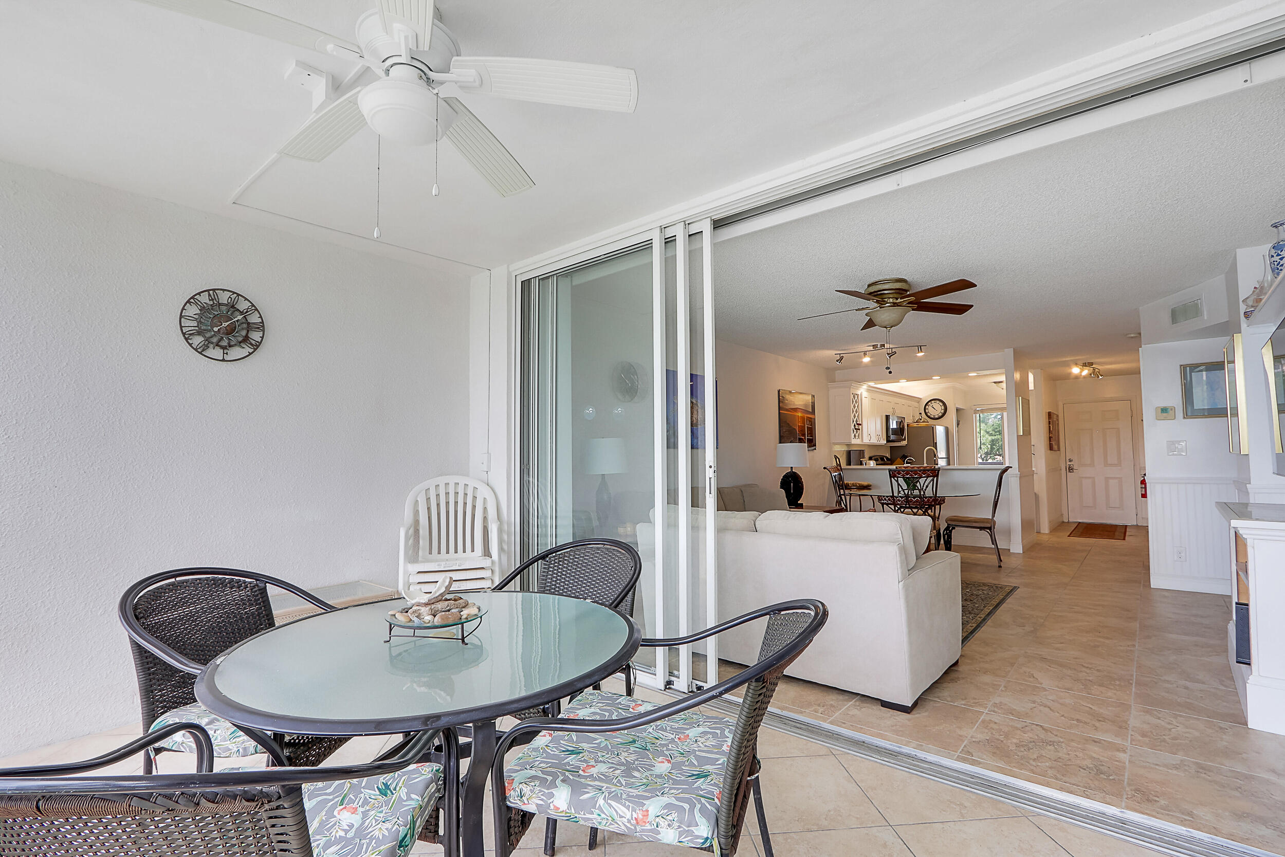 353 Highway 1, Unit A207 Jupiter, FL 33477 - Photo 26 of 28 a view of a dining room with furniture and a chandelier fan