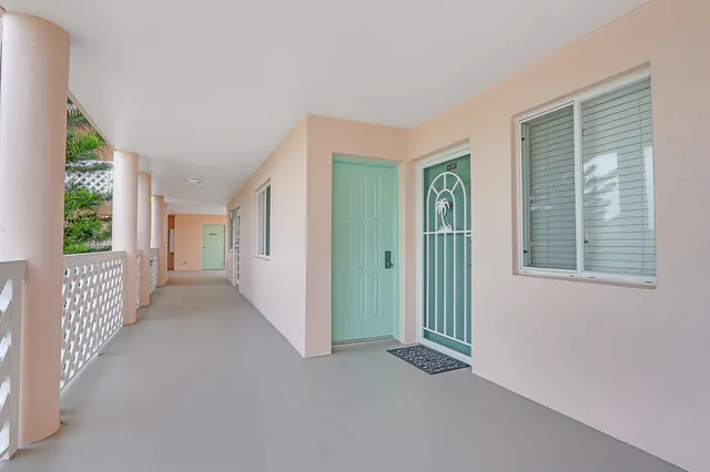a view of a hallway with windows
