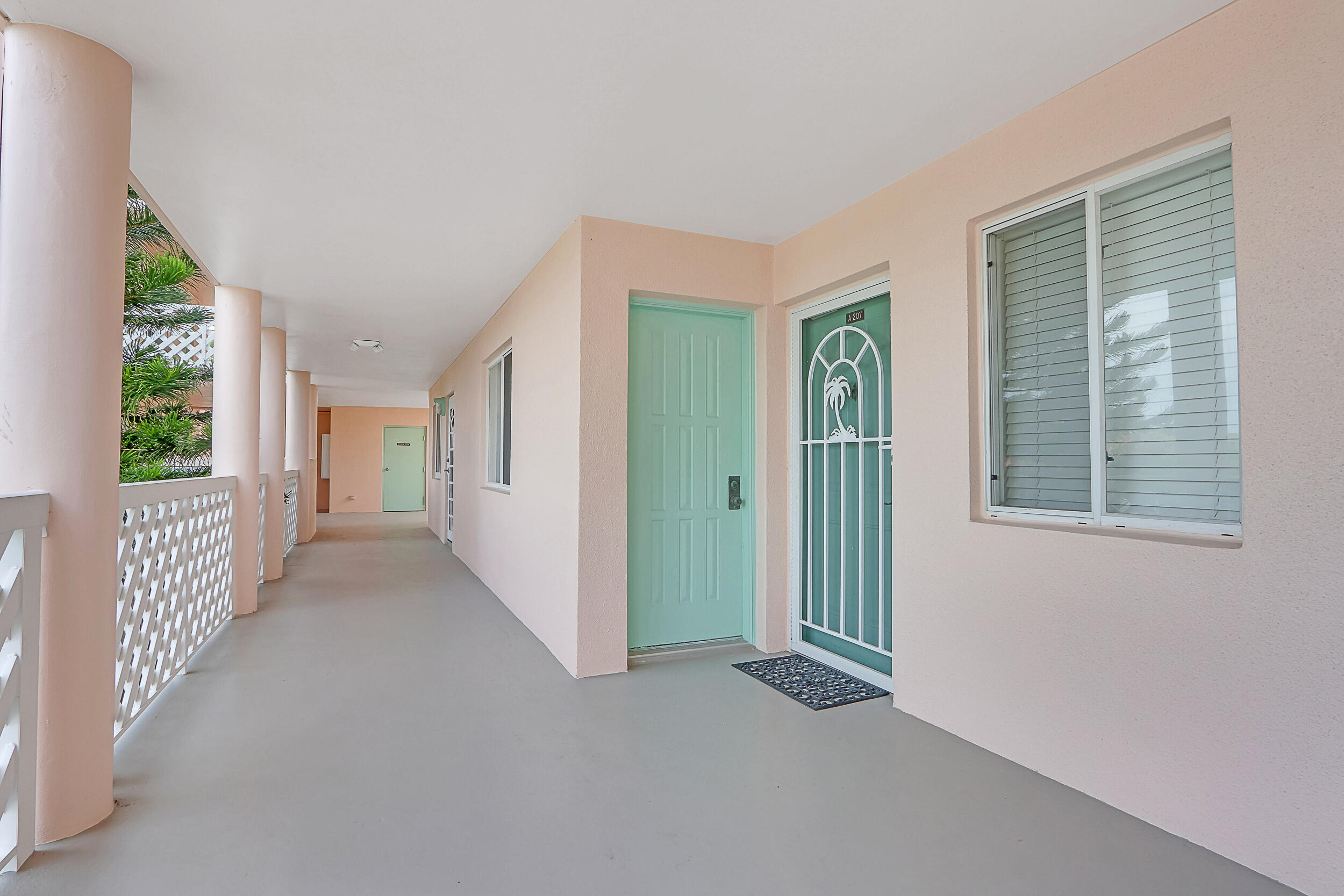 353 Highway 1, Unit A207 Jupiter, FL 33477 - Photo 3 of 28 a view of a hallway with windows