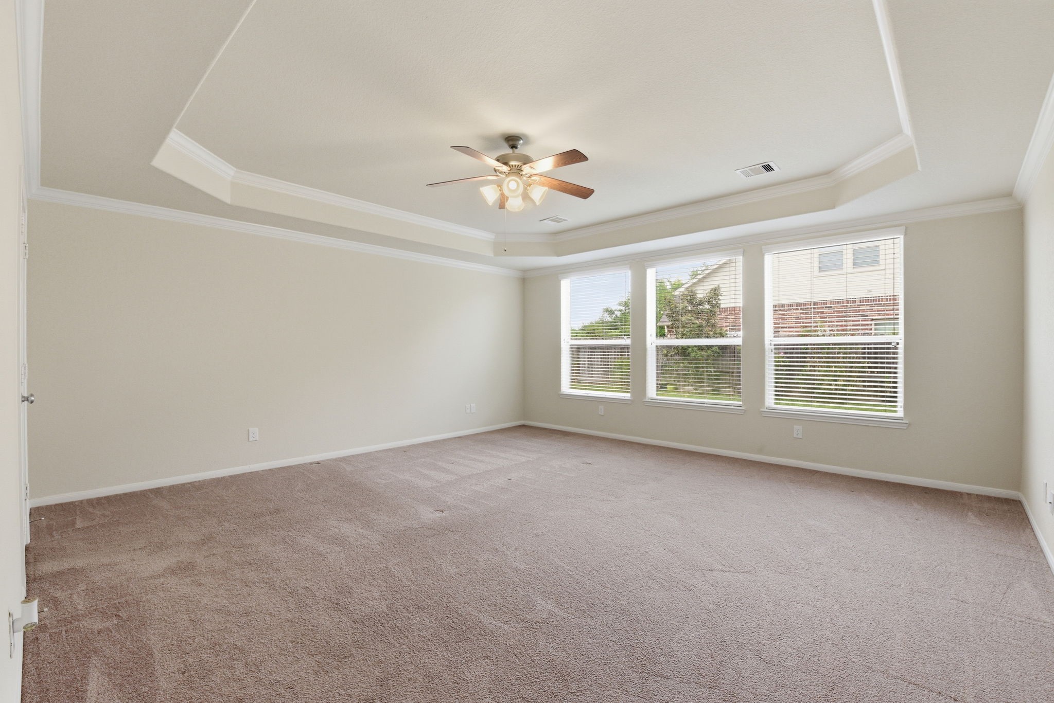 3301 Remington Rise Lane Katy, TX 77494 - Photo 20 of 50 an empty room with chandelier fan and windows