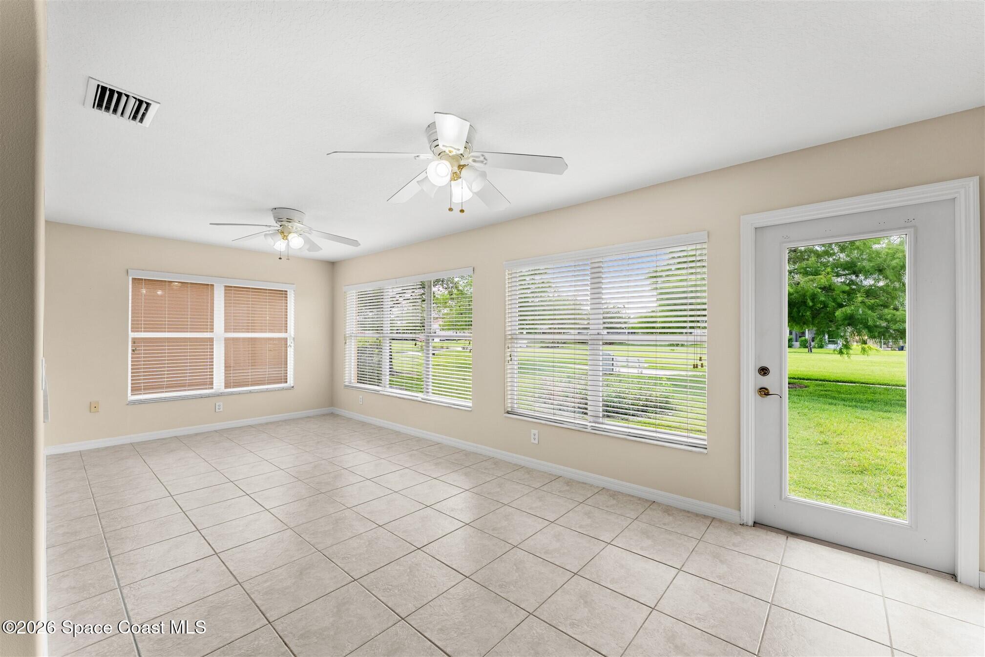 6904 Renshaw Drive Melbourne, FL 32940 - Photo 17 of 46 a view of an empty room with a window