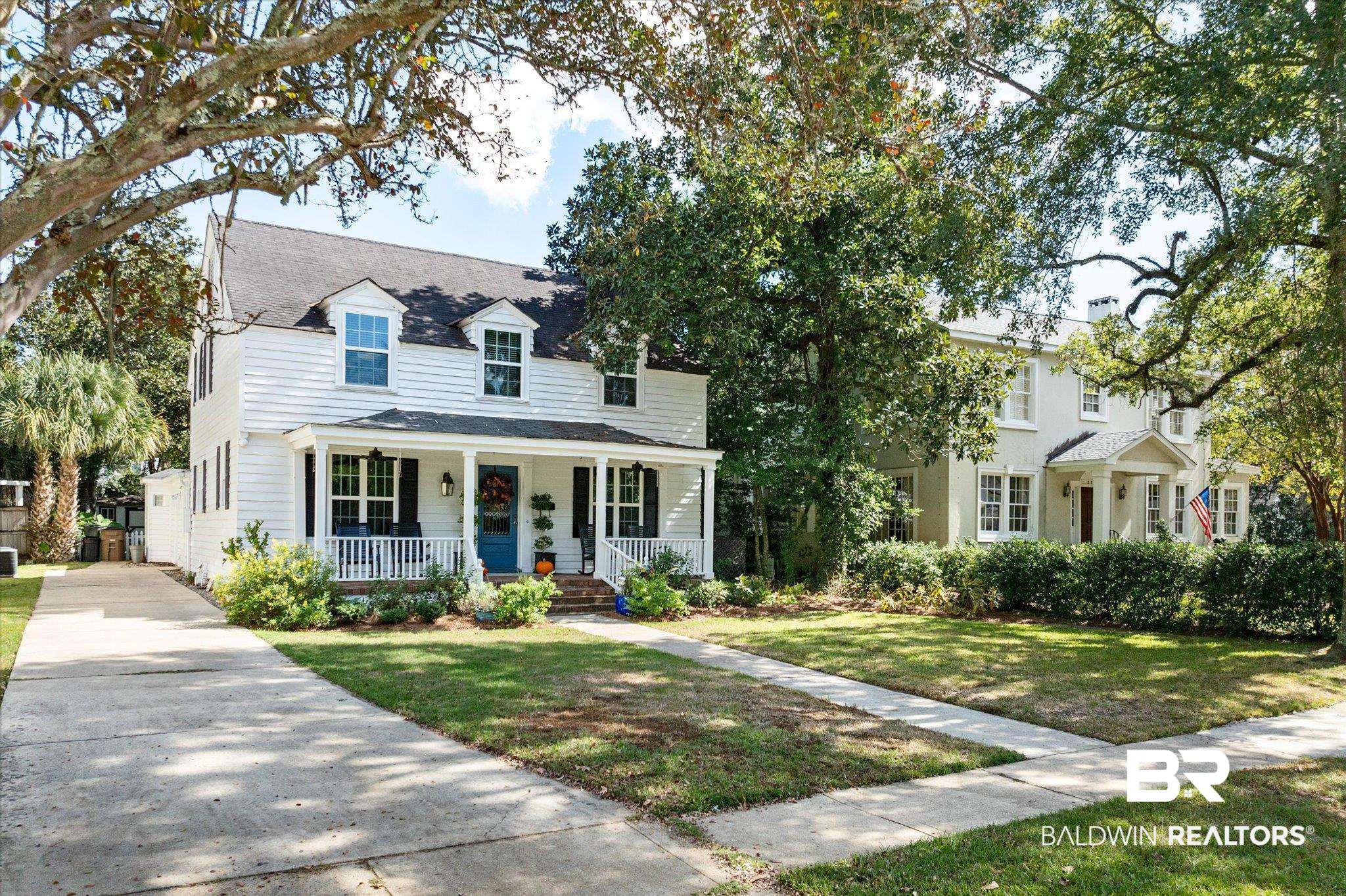 202 Woodlands Avenue Mobile, AL 36607 - Photo 40 of 53 View of front facade featuring a front yard and covered porch